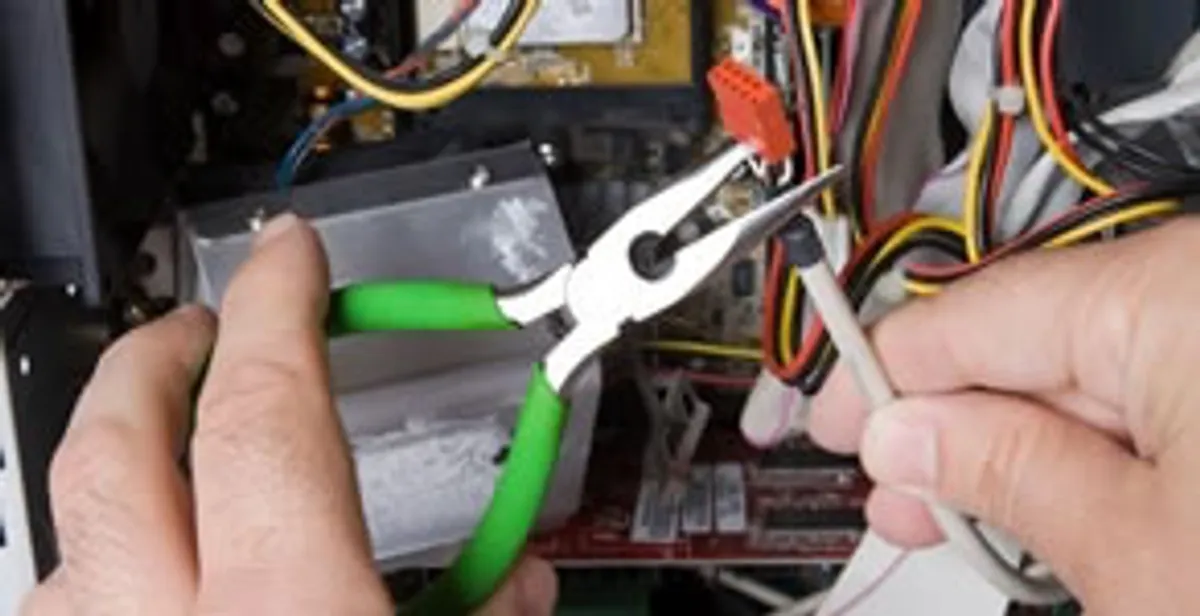 Licensed electrical contractor performing electrical repair with tools in Smoketown, PA